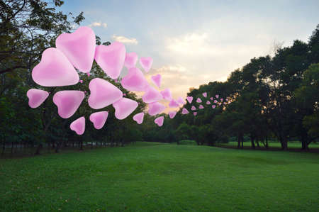 Pink heart love balloon float on air at park, vintage styleの写真素材