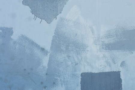textured abstract paint stroke on blue wall