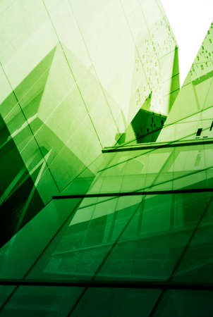 Glass of modern tower for business background green toneの写真素材