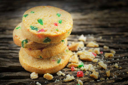 Mixed fruits cookies on old wooden backgroundの写真素材