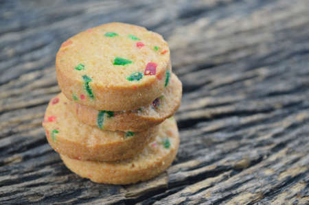 Mixed fruits cookies on old wooden backgroundの写真素材
