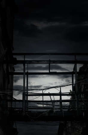 Damaged old wooden bridge pathway connections; mysterious backgroundの写真素材