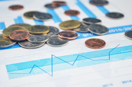 Thailand coins on business graph, accounting backgroundの写真素材