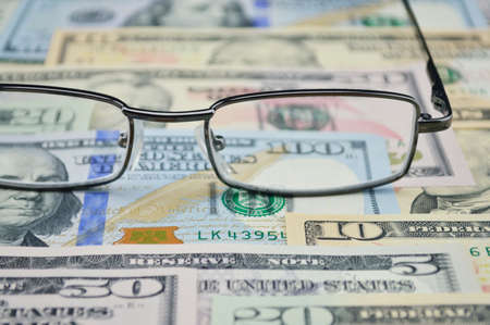 Glasses on dollar money, financial and business conceptの写真素材