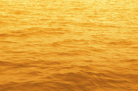 Gold water surface texture, Deep sea wavesの写真素材