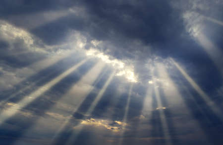 Sunset sky and clouds with light raysの写真素材