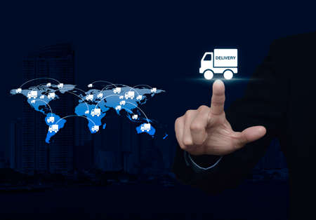 Businessman pressing delivery truck icon with connection line over map and city background, Logistic conceptの写真素材