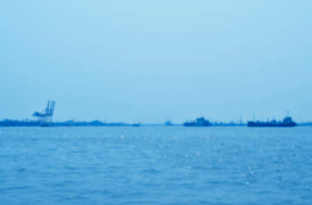 Blur of cargo ship with shipping portの写真素材