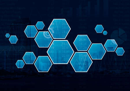 Blank hexagon shape virtual technology screen over graph, number and city tower background, blue toneの写真素材