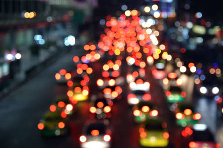 Blurred colourful night light city with cars, Abstract background
