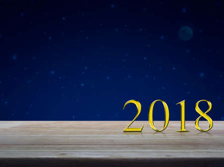 Happy new year 2018 gold metal text on wooden table over fantasy night sky and moon
