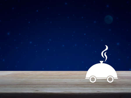 Restaurant cloche flat icon on wooden table over fantasy night sky and moon, Business food delivery online service conceptの写真素材