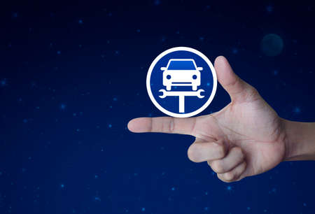 Hand pressing service fix car with wrench tool flat icon over fantasy night sky and moon, Business repair car online conceptの写真素材