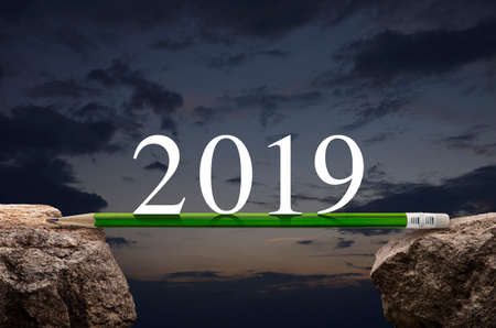 2019 white text with green pencil on rock over sunset sky, Business success strategy plan concept, Happy new year 2019 calendar coverの写真素材