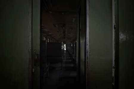 Interior in empty cabin with green seat of old diesel train, Dramatic tone, Mystery backgroundの写真素材