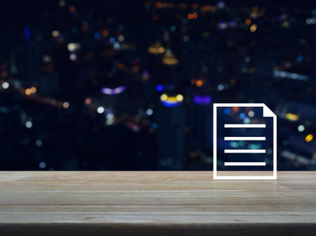 Document flat icon on wooden table over blur colorful night light city tower and skyscraper, Business communication conceptの写真素材