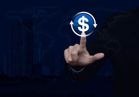 Businessman pressing money transfer flat icon over world map, modern city tower and skyscraper,...