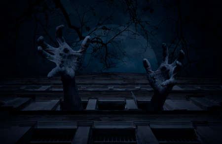 Zombie hand rising out from old ancient window castle building over dead tree, full moon and cloudy...