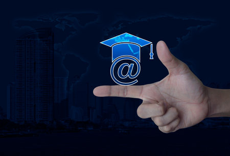 e-learning flat icon on finger over world map, modern city tower and skyscraper, Business study...