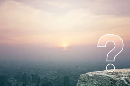 Question mark sign flat icon on rock mountain over aerial view of cityscape at sunset, vintage...