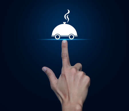 Hand pressing restaurant cloche flat icon over blue background, Business food delivery online conceptの写真素材