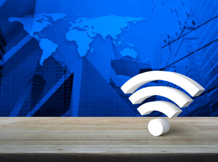 Wi-fi 3d icon on wooden table over world map, modern office city tower and skyscraper, Technology internet communication conceptの写真素材