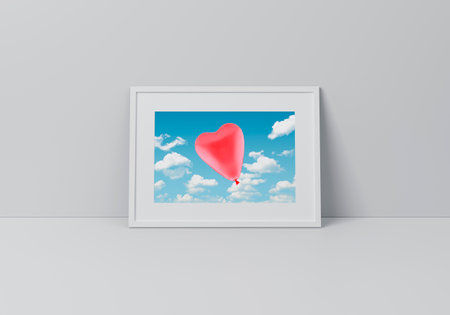 Red love heart balloon over sky poster in horizontal white frame on floor over grey wall, Valentines...