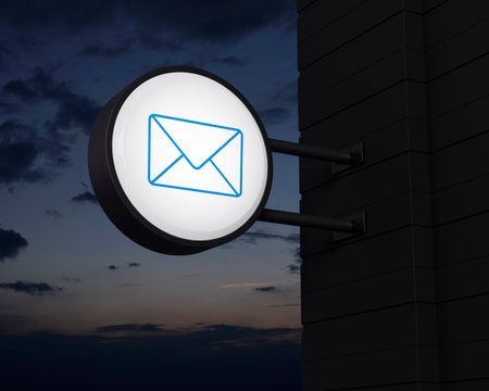 email icon on hanging black rounded signboard over sunset sky, Business contact us online concept, 3D renderingの写真素材