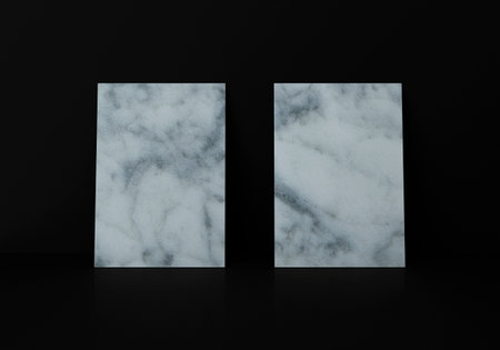 Two marble texture vertical rectangle A4 paper sheet mockup on floor over black wall, 3D renderingの写真素材