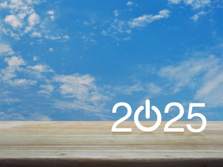 2025 start up business flat icon on wooden table over blue sky with white clouds, Happy new year 2025 success conceptの写真素材