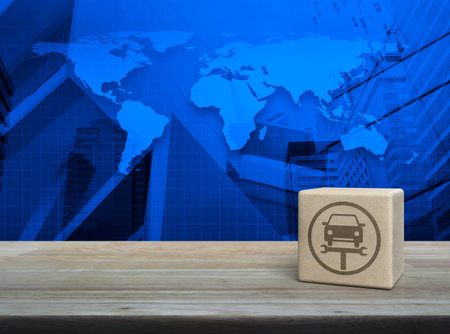 Service fix car with wrench tool icon on wood block cube on wooden table over world map, modern office city tower and skyscraper, Business repair car service concept, Elements of this image furnished by NASAの写真素材