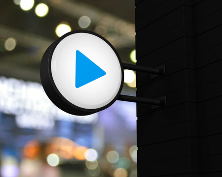 Play button icon on hanging black rounded signboard over blur light and shadow of shopping mall, Business music online concept, 3D renderingの写真素材