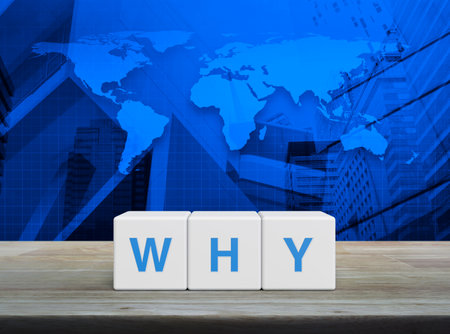 Letter on white block cubes on wooden table over world map, office city tower and skyscraper, Business communication conceptの写真素材