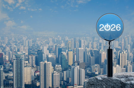 2026 start up flat icon with magnifying glass on rock mountain over modern city tower, office...
