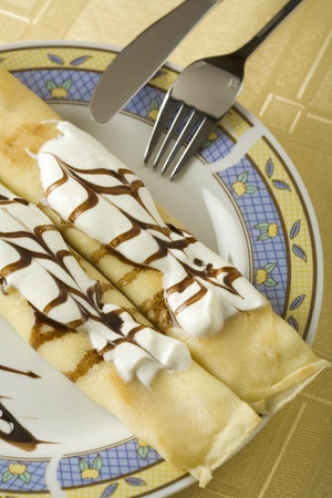 Two pancakes with cheese and sour creamの写真素材