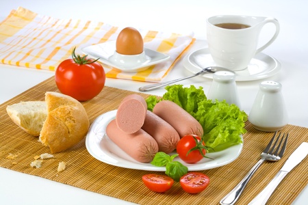 Breakfast sausages, tomato, egg の写真素材