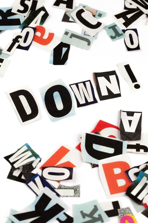 Down inscription made with cut out lettersの写真素材