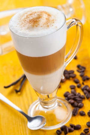 Coffee latte on yellow backgroundの写真素材