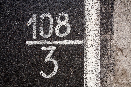 Numbers and digits on the asphalt