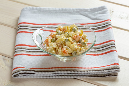 Multi vegetable salad in glass bowl on textileの写真素材