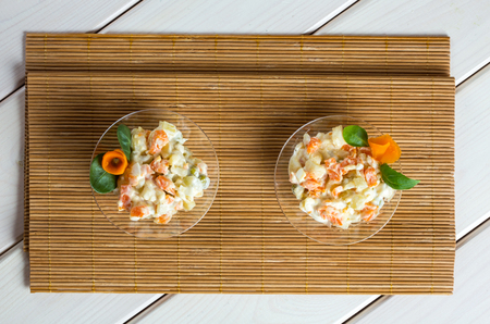 Multi vegetable salad in glass bowl on textileの写真素材