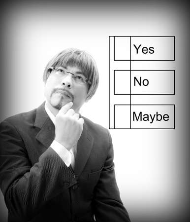 Portrait of a Businessman   thinking how to choosing yes,no,maybe BWの写真素材
