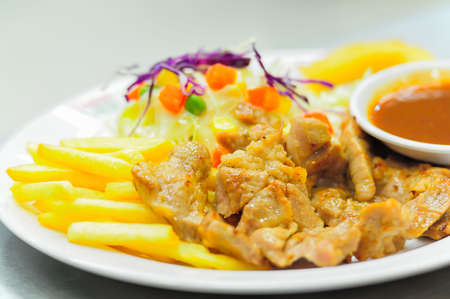 Grilled steak, French fries and vegetables,Saladの写真素材