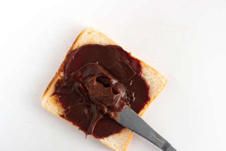 choco spread with bread on white background