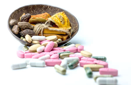 Many pills and tablets isolated on white backgroundの写真素材