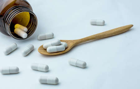 Many pills and tablets isolated on white backgroundの写真素材