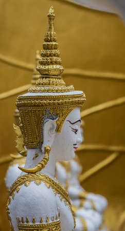A gold Deity sculpture in the templeの写真素材
