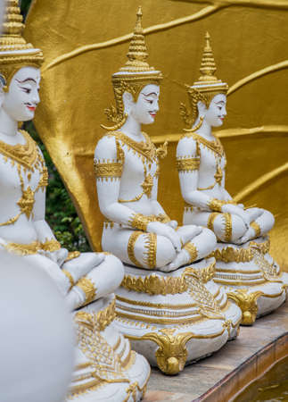 A gold Deity sculpture in the templeの写真素材