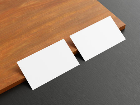 Clean minimal business card mockup on wood backgroundの写真素材