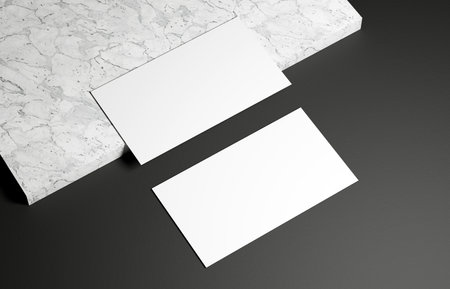Business card on marble and black backgroundの写真素材